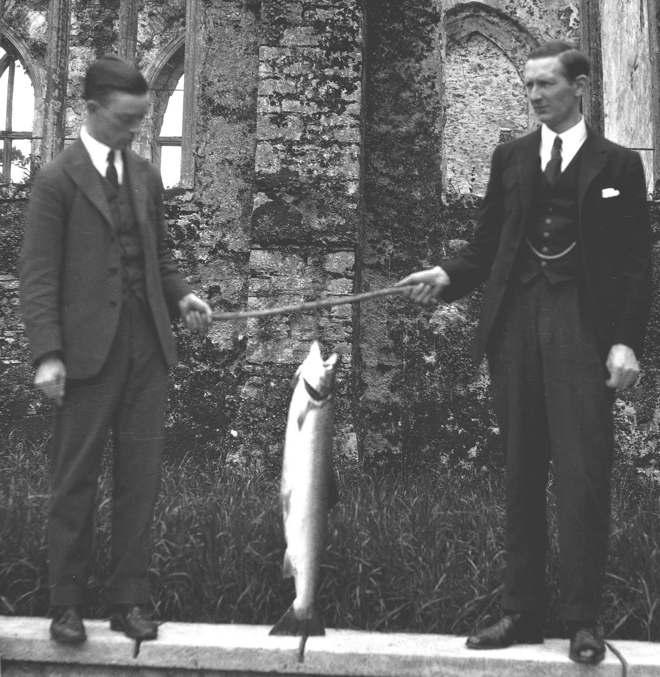 L-R: Herbert Mills, Walter Thomas, with a salmon they caught in the Dart at Folly Pool.